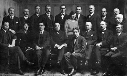 The Editorial, Financial and Wire Room members of the Manchester Guardian staff in 1921. Back row: Messrs. F. Marshall, J.M. Denvir, R. Nelson, F.W. Long, J.H. Foxcroft, I. Brown, E.N. Smith, F. Perrot, A. Percival Middle row: Mrs. Avis, Mr. H. Rose Front row: Mr. H. Gravett, Miss E. Isitt, Messrs. O.R. Hobson, J. Bone, H. Dore, J. Drysdale, A.H. Boyd, H. Williams