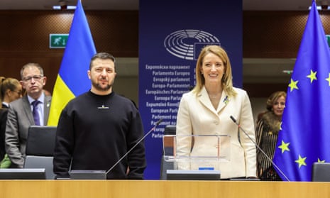 European Parliament President Roberta Metsola stands during Zelenskiy’s address