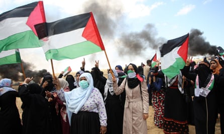 Palestinian women in Rafah, southern Gaza, stage a protest to mark the 70th anniversary of Nakba in May 2018