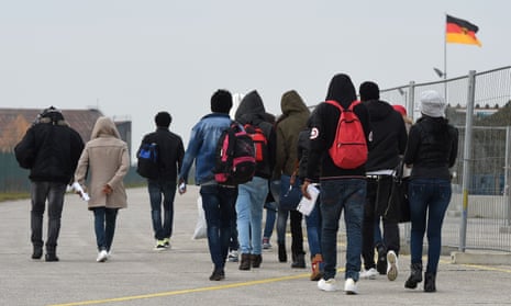 Migrants arrive at a registration centre for asylum seekers near Munich