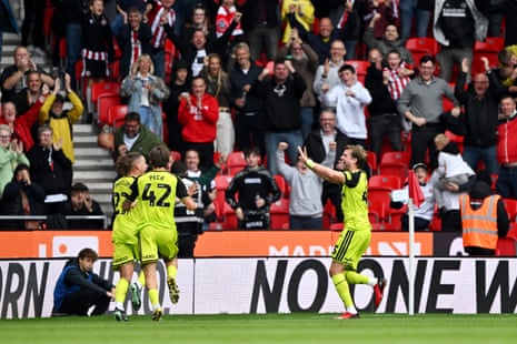 Sheffield United players race to congratulate Kalvin Phillips (far left) after his goal.