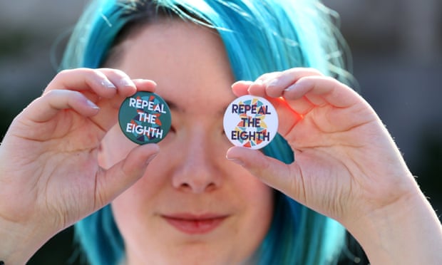 A woman holds up badges as she takes part the March for Choice, calling for the legalising of abortion in Ireland.