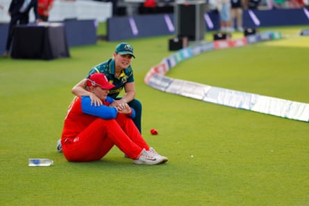 Sophie Ecclestone is consoled by Georgia Voll aft England’s defeat.
