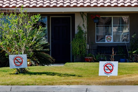 No Data Center signs are posted in the front yard of a home