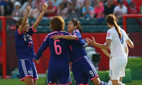 Japan’s players celebrate their last minute winning goal.