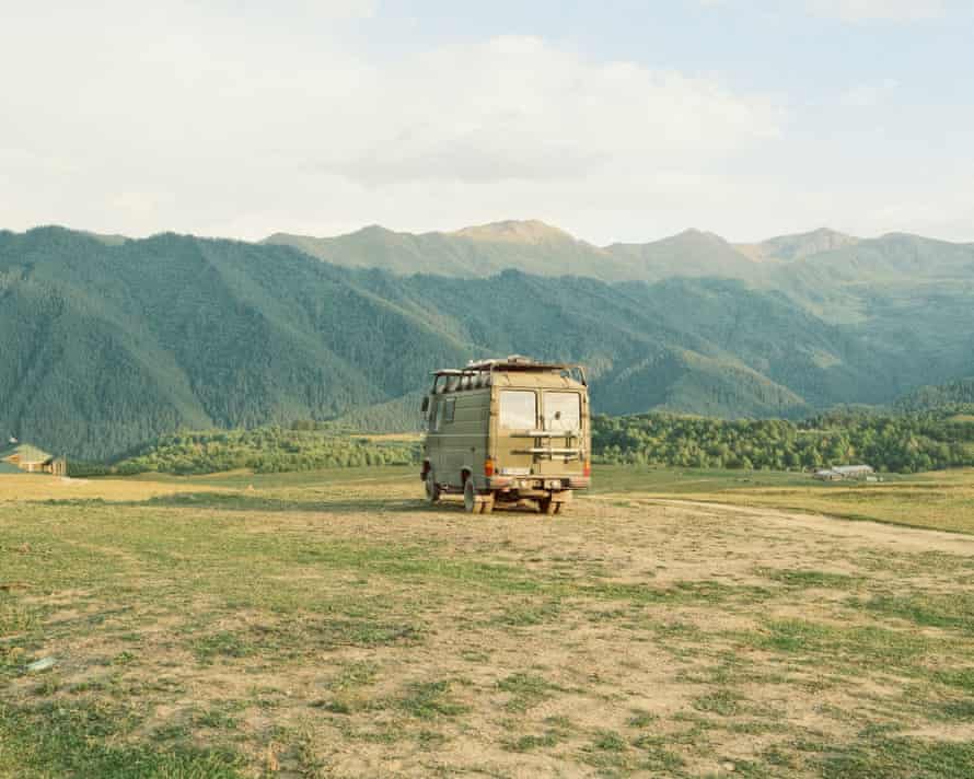 There is a van owned by tourists on the outskirts of Lower Omalo.