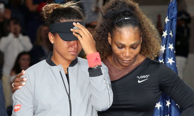 Serena Williams puts her arm around Naomi Osaka