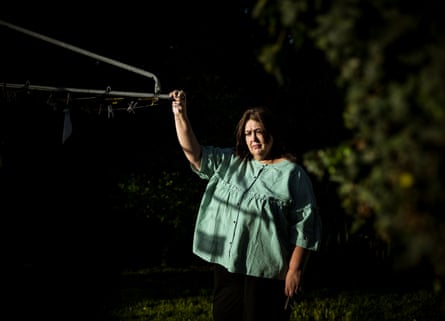 Jeannie-Marie Blake stands next to a clothes line