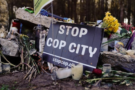 A sign reads 'stop cop city'