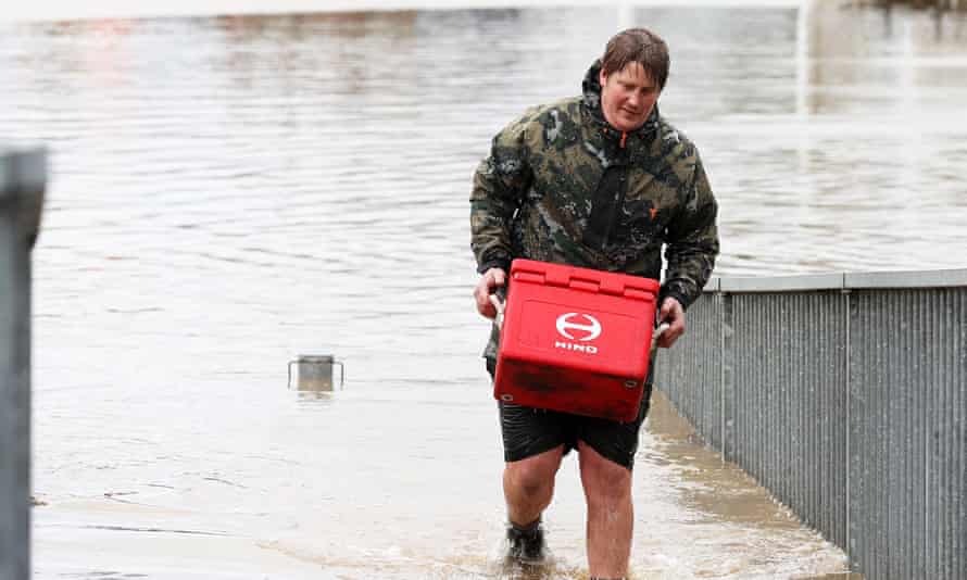 New Zealand flash floods force evacuations in Auckland, motorists rescued by jet ski 1 A man removes property from his business in Weza lane, Kumeu as heavy rain causes extensive flooding and destruction on August 31, 2021 in Auckland, New Zealand.