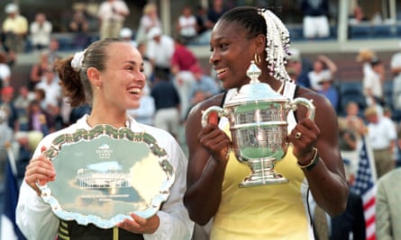 Serena Williams and Martina Hingis smile and pose with their trophies after the US Open final in 1999.