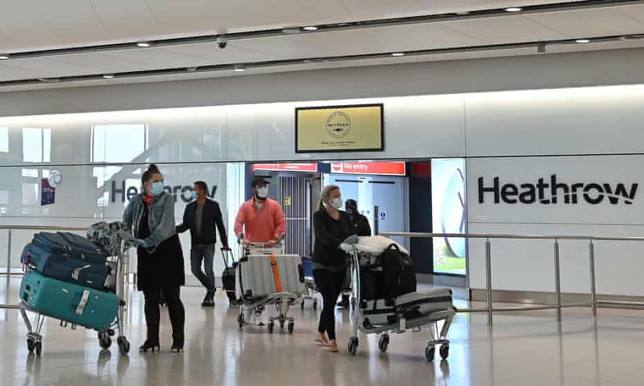 Passengers wearing personal protective equipmentat Heathrow airport