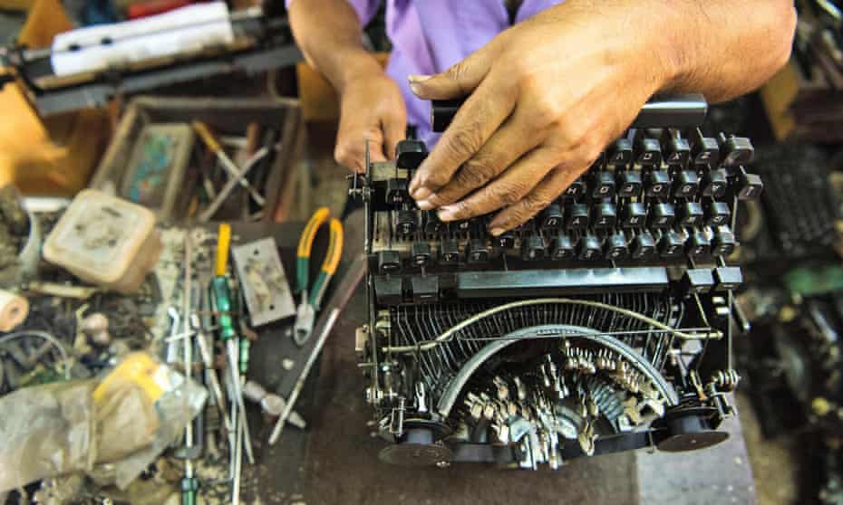 A technician repairs an old manual typewriter in Mumbai, Maharashtra, India. 