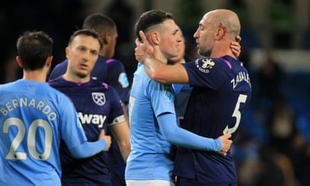 Phil Foden embraces former teammate Pablo Zabaleta at the final whistle.