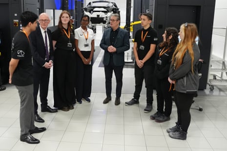 Keir Starmer and Pat McFadden, the work and pensions secretary, talking to graduates and apprentices at McLaren Automotive in Surrey today.