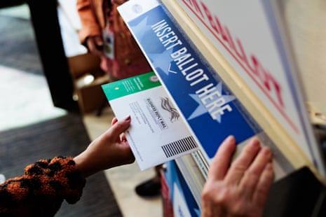 a person mailing a ballot