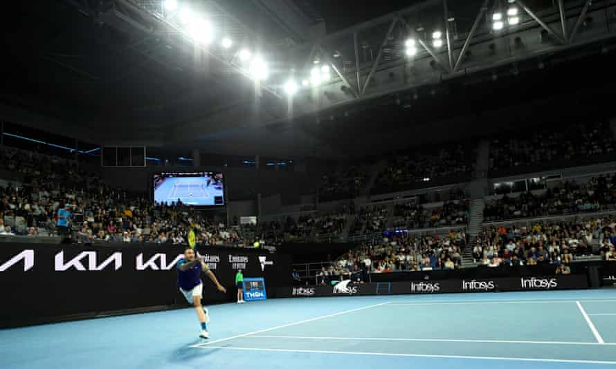 Nick Kyrgios hits a forehand