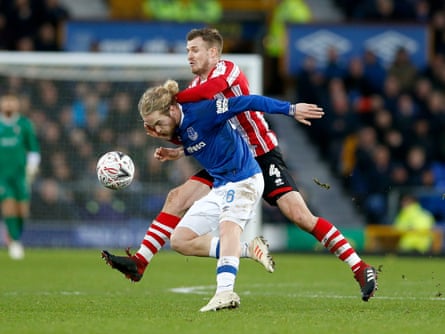 Tom Davies is fouled by Lincoln’s Michael O’Connor