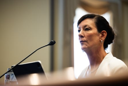 Woman speaks into microphone