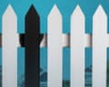 movie poster with white picket fence with one column painted black