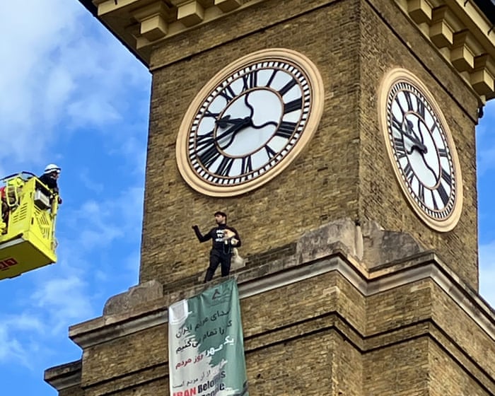 Man and dog taken down from King’s Cross clock tower after Iran protest