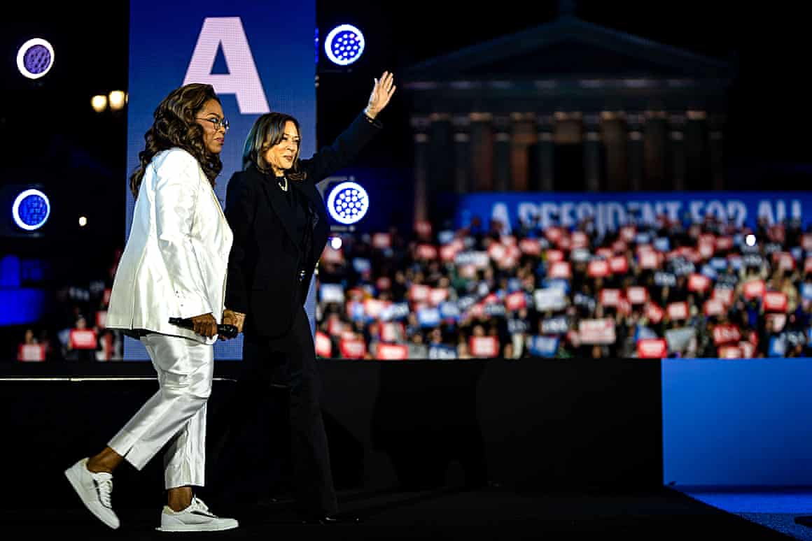 Kamala Harris speaks alongside Oprah Winfrey during her presidential campaign