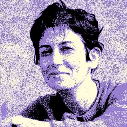 A photo of a smiling woman with short hair