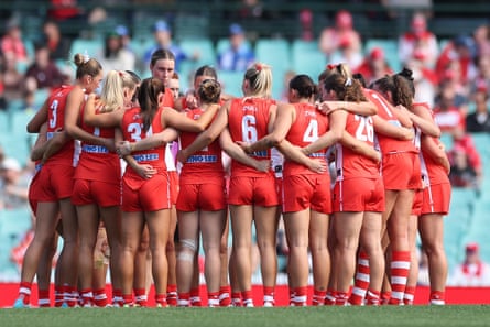 Swans players huddle during the round two AFLW match against Essendon