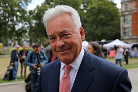 Alan Duncan walks through College Green, near the Houses of Parliament.