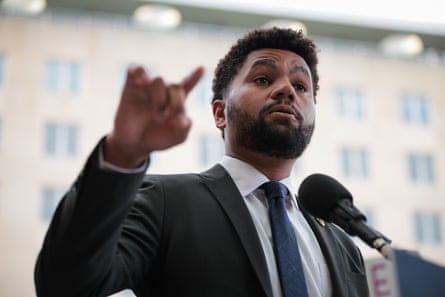 a man speaking in front of a microphone