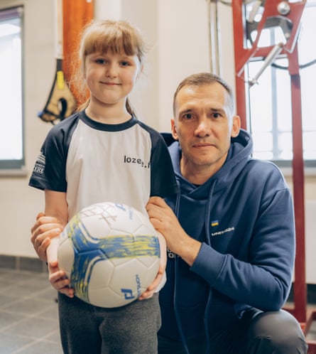 Andriy Shevchenko with Maryna, the first child in Ukraine to receive a prosthetic limb after her leg was blown off by a Russian missile.