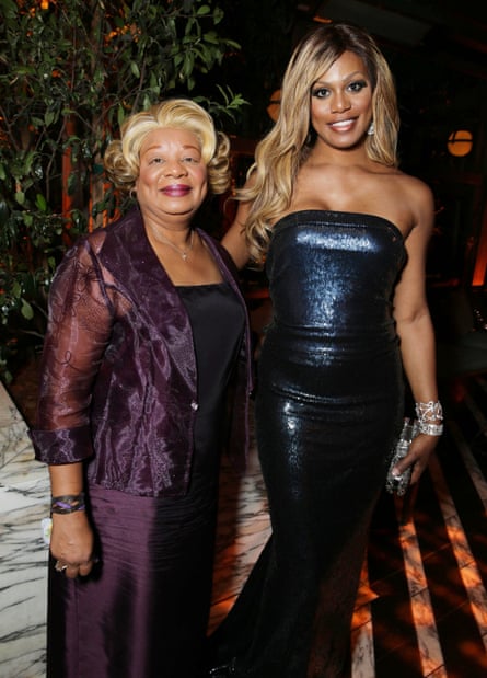 Laverne Cox and her mother both wearing glamorous evening wear and smiling