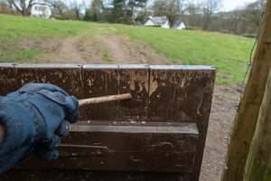 Is this the new normal? A walker uses a stick to open a gate in Wharfedale, West Yorkshire.