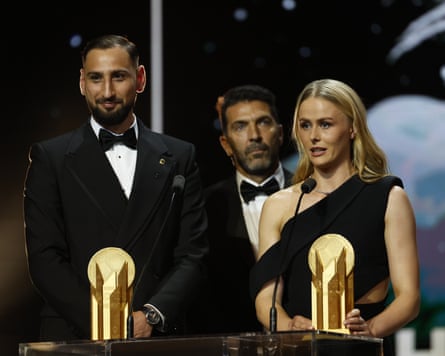 Italy’s goalkeeper Gianluigi Donnarumma (left) and England’s goalkeeper Hannah Hampton accept their Yashin Trophies