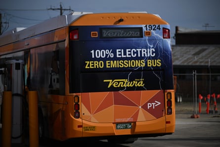 A bus with a sign reading ‘100% electric, zero emissions bus’ at a charging depot in Melbourne