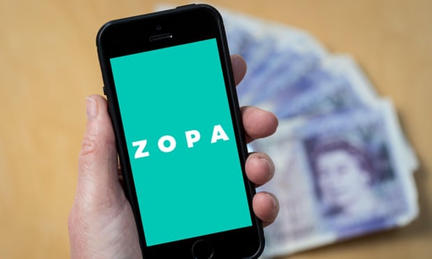 A woman looking at the Zopa Bank logo on a mobile phone