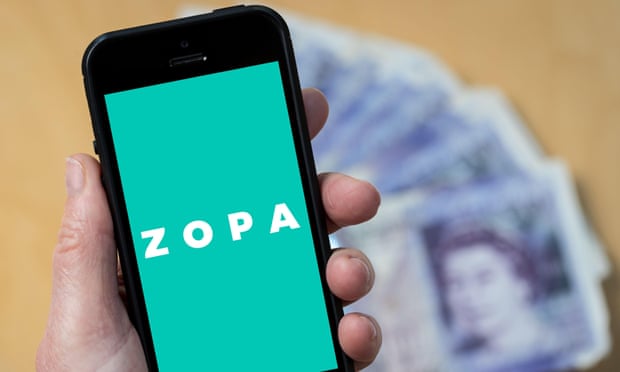Someone looks at the Zopa logo on a mobile phone.