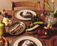 Festive table with flowers, fruit, vegetables and place settings