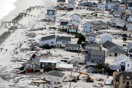 Wrecked houses along a beach.