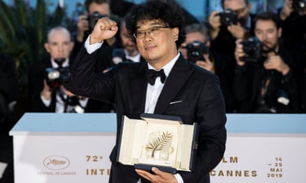 Defiant ... director Bong Joon-ho poses with the Palme d’Or award at the Cannes film festival in 2019.