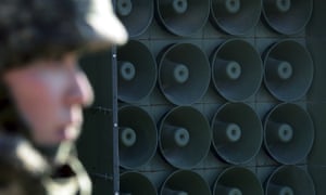 a South Korean soldier stands near the loudspeakers near the border area between South Korea and North Korea