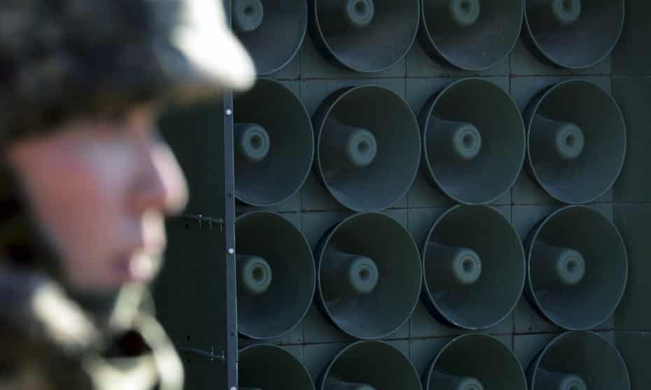 a South Korean soldier stands near the loudspeakers near the border area between South Korea and North Korea