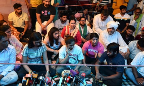 Demonstrators including Vinesh Phogat and Sakshi Malik  talk to the media at the protest in New Delhi
