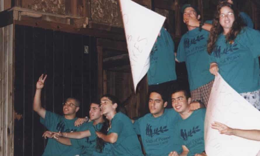 Aseel Aslih (seated far right) and Roy Cohen (seated third from right) at a Seeds of Peace camp in the 1990s.