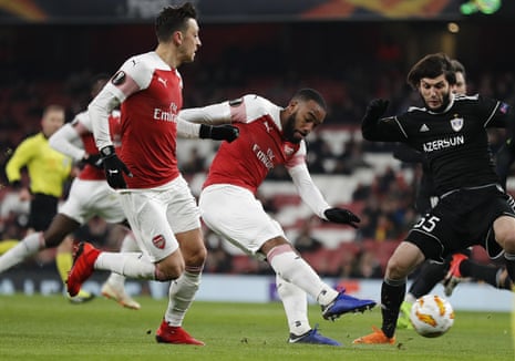 Arsenal’s Alexandre Lacazette shoots to score his side’s first goal