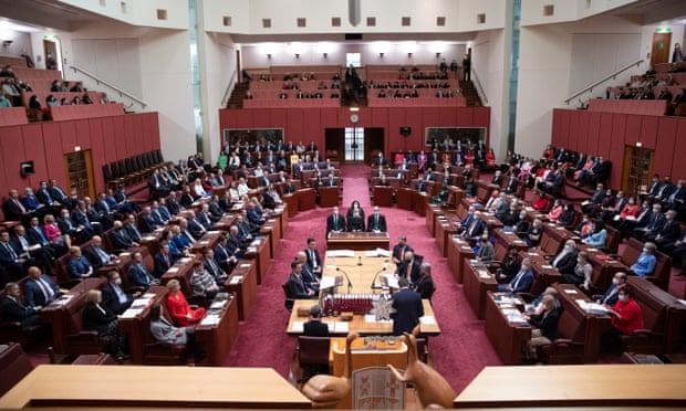 Elected members of the House of Representatives join the elected senators in the Senate chamber of Parliament House in Canberra