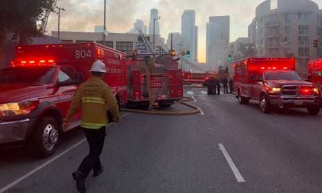Firefighters respond to an explosion in downtown Los Angeles that has injured multiple firefighters