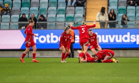 Wales celebrate Hannah Cain’s equaliser against Sweden in Gothenburg.