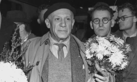 Peace envoy: Picasso is presented with a bunch of flowers as he arrives in Sheffield, November 1950. 