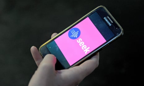 The logo of job seeking website 'Seek' is seen on a phone screen